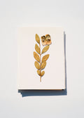 Hand-pressed botanical card with gold pressed flower on cream paper
