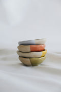 Hand-thrown stoneware bowls stacked, oat and sage glaze