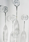 Set of four long-stemmed clear crystal wine glasses